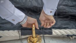 Closing the Ka'ba curtain to the rings embedded in Shazervan.