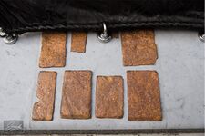 Eight pieces of marble that are on the stone next to the door of the Ka'ba.