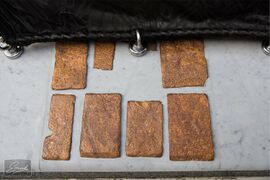 Eight pieces of marble that are on the stone next to the door of the Ka'ba.