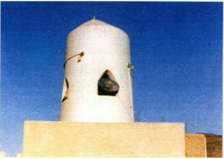 Short, dome-shaped minaret of the mosque