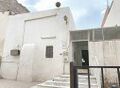 The exterior environment of the mosque with white walls and white color scheme